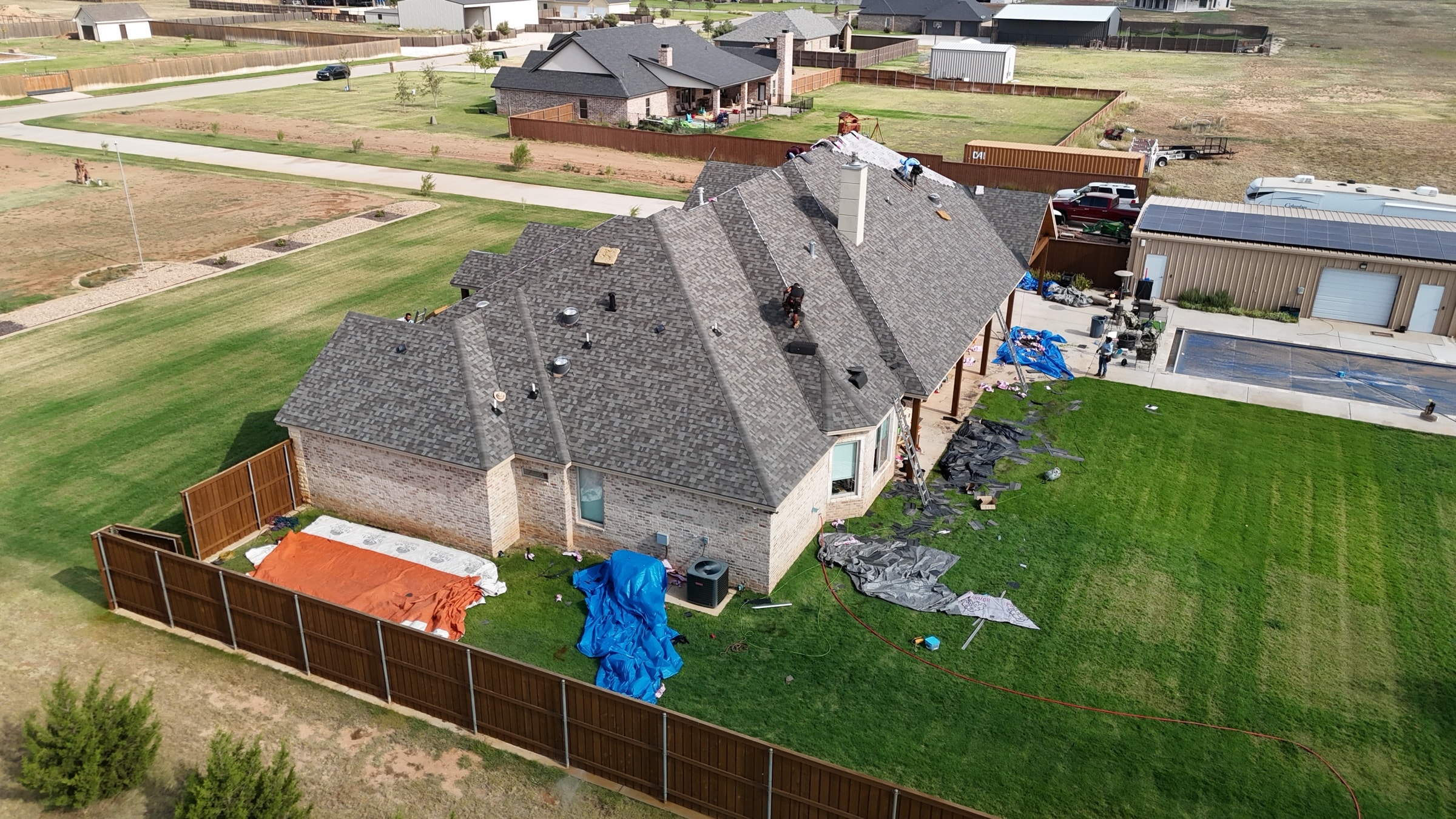 Rain Roofing crew completing an Owens Corning installation
