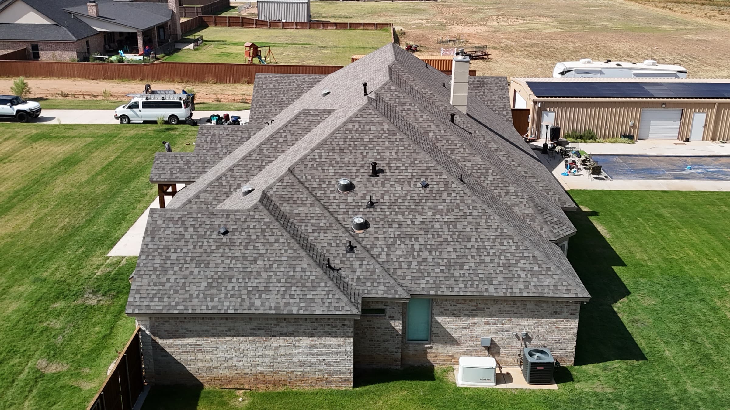 Aerial view of a roof inspection in progress
