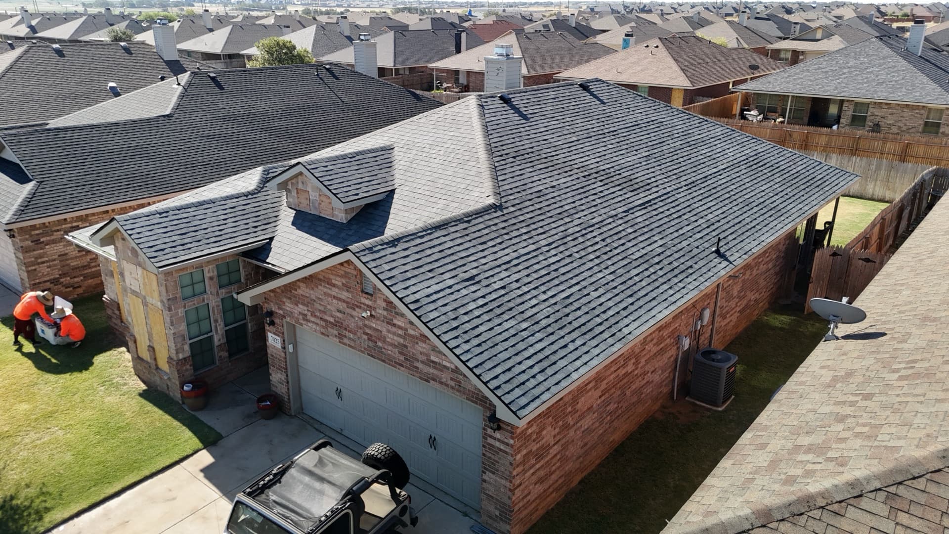 Aerial view of completed residential roof by Rain Roofing
