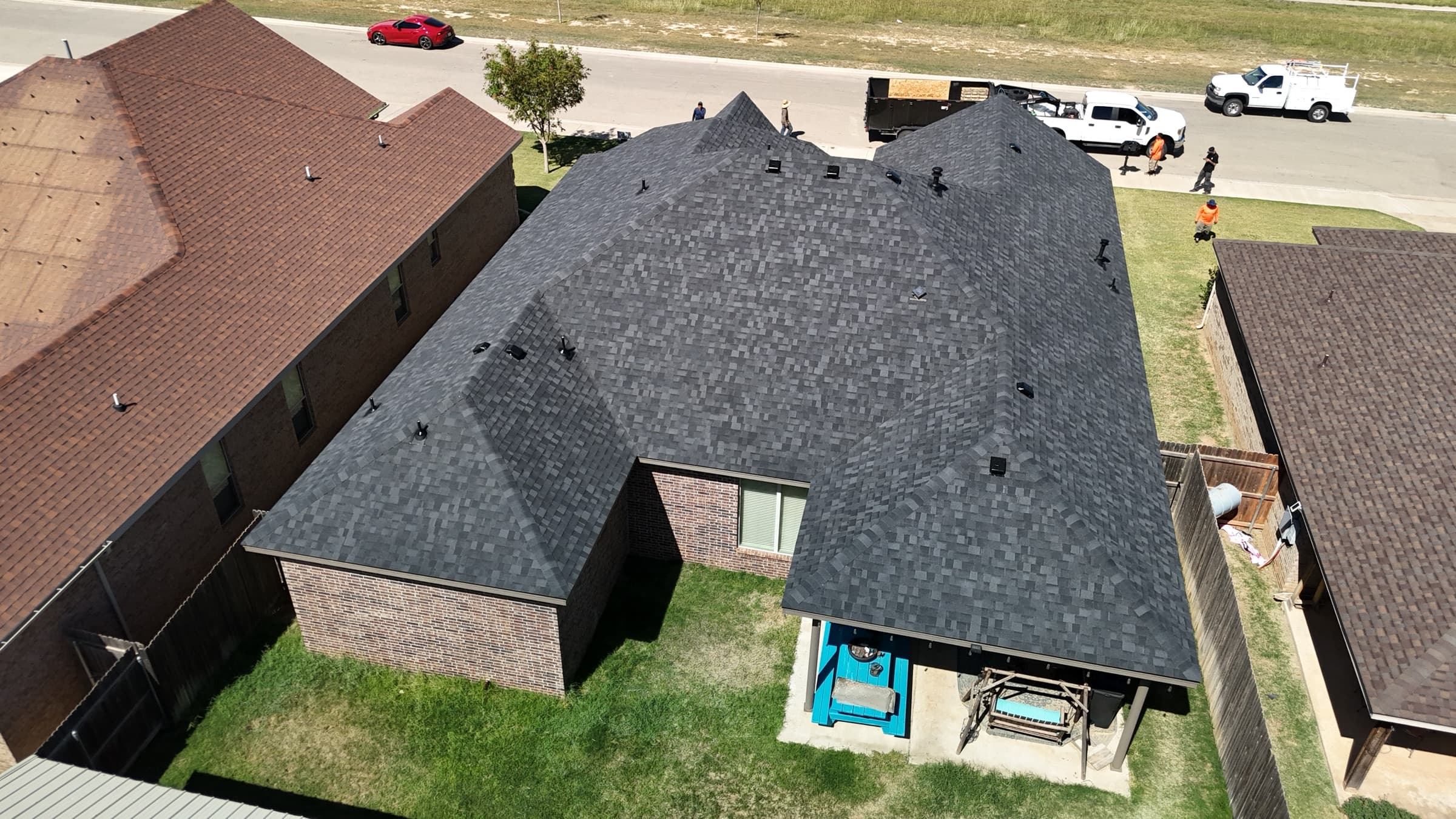 Completed shingle roof replacement — aerial view